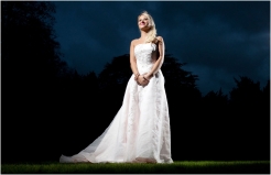 Bride in the garden of Stonehouse Court at dusk