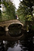 Bride and Groom on the bridge at Hogarths Hotel