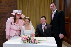 Signing the register of marriages at St.Johns Church at Palmers Green