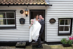 Groom carrying the Bride over the threshold
